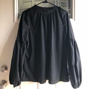 Black trumpet sleeve shirt